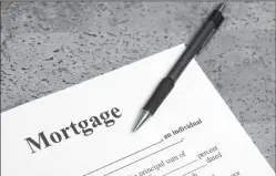  ?? DREAMSTIME ?? Despite low interest rates, many homeowners still haven't refinanced their mortgages.