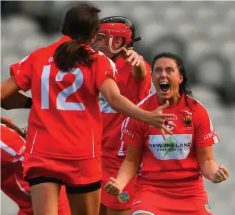  ??  ?? Jubilation: Cork’s Gemma O’Connor (right) celebrates with teammates at the final whistle. Left: Hannah Looney of Cork throws the O’Duffy Cup in the air. Far left: Dejected members of the Kilkenny team. Photos: David Fitzgerald/ Caroline Quinn