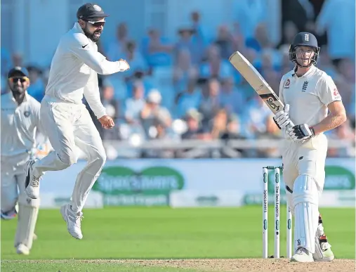  ??  ?? UPS AND DOWNS: India captain Virat Kohli hits the heights as he celebrates the dismissal of England’s Jos Buttler for 106 runs