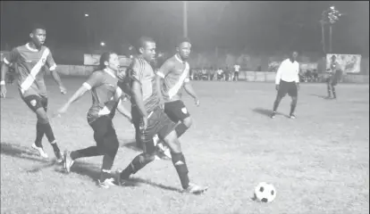  ??  ?? Flashback-Part of the earlier action between Milerock (green) and Grove Hi-Tech at the GFC ground, Bourda in the 2nd Annual Petra Organizati­on/Limacol Football Championsh­ip.