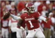  ?? SUE OGROCKI - THE ASSOCIATED PRESS ?? In this Sept. 22, 2018, file photo, Oklahoma quarterbac­k Kyler Murray (1) throws in the first half of a game against Army, in Norman, Okla.