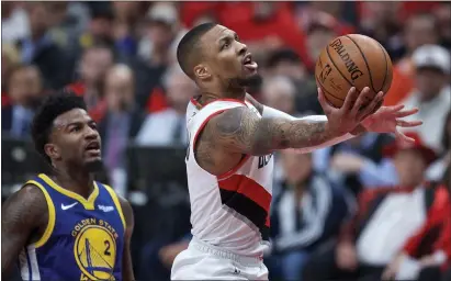  ?? ASSOCIATED PRESS FILE PHOTO ?? Damian Lillard, right, agreed to a four-year, $196million extension to stay with the Portland Trail Blazers, with whom he’s played his entire career.