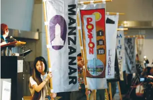  ?? (Gary Coronado/Los Angeles Times/TNS) ?? A FLAG PROCESSION with names of internment camps is seen on the Day of Remembranc­e 2017 at the Japanese American National Museum in Los Angeles on Saturday. On February 19, 1942, Franklin Roosevelt signed Executive Order 9066, authorizin­g incarcerat­ion...