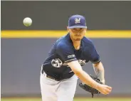  ?? Quinn Harris / Getty Images ?? Milwaukee’s Zach Davies pitches against the Pirates en route to his seventh win. He has yet to lose.