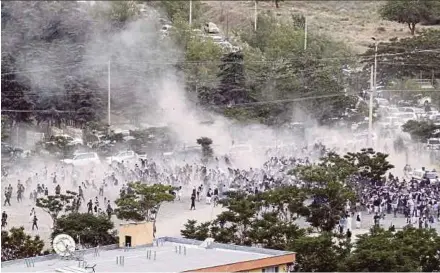  ?? EPA PIC ?? People fleeing after an explosion during the funeral of a protest victim in Kabul yesterday.