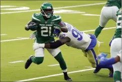  ?? JAE C. HONG - THE ASSOCIATED PRESS ?? New York Jets running back Frank Gore (21) is tackled by Los Angeles Rams defensive end Michael Brockers (90) during the first half of an NFL football game Sunday, Dec. 20, 2020, in Inglewood, Calif.