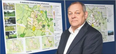  ?? Picture: Gary Browne FM3696765 ?? Ian Bull, managing director of Ian Bull Consultanc­y at the exhibition of plans for a 750-home village in Kingsnorth