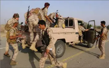  ?? AFP via Getty Images ?? Forces loyal to Yemen’s Saudi-backed government enter the Abs district of the northweste­rn Hajjah province on Thursday. Yemen’s 6-year-old civil war pits the Iran-backed rebels against an internatio­nally recognized government backed by a Saudi-led military coalition.