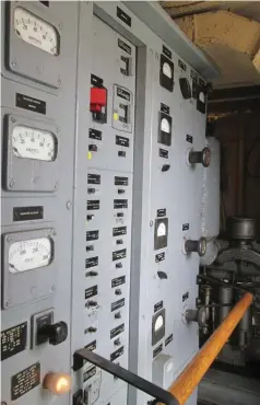  ??  ??  Much of the small compartmen­t is taken up by a power distributi­on panel. This is old-school stuff but the unit still works as designed and when main power from the ship’s two 300 KW steam turbo-generators drops off, the old Cat will automatica­lly...