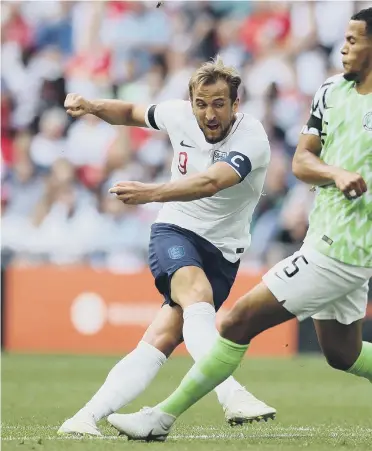  ??  ?? England captain Harry Kane clinically fires home the second goal in Saturday’s victory over Nigeria.