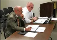  ?? MARK ROBARGE — MROBARGE@TROYRECORD.COM ?? Troy Mayor Patrick Madden, left, watches as Deputy Comptrolle­r Andy Piotrowski addresses the Troy City Council’s Finance Committee during a Wednesday night meeting in City Hall to discuss Madden’s proposed 2018 city budget.