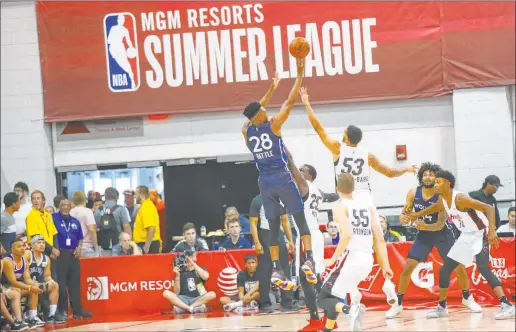  ?? Chase Stevens Las Vegas Review-journal @csstevensp­hoto ?? Minnesota product Tyus Battle, left, shoots over Miami prospect Nick Weiler-babb in a Vegas Summer League clash at the Cox Pavilion in July 2019.