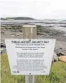  ??  ?? A sign warning people against visiting the beach.