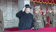  ?? KRT VIA AP VIDEO ?? North Korean leader Kim Jong Un (center) attends Thursday’s military parade in Pyongyang. Virtually all foreign media were excluded from the event.