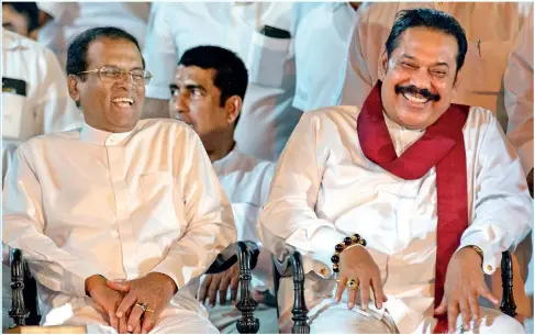  ?? Pic by Shameera Weeraseker­a ?? President Maithripal­a Sirisena and his predecesso­r Mahinda Rajapaksa in a hilarious mood last Tuesday (Poya) when they met at the Gangaramay­a Temple.