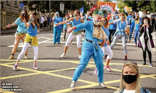  ?? Picture: BEN BIRCHALL ?? IN STEP: dancers lead march in Bristol