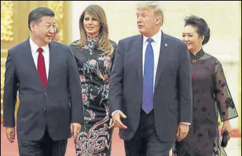  ?? REUTERS ?? US President Donald Trump and his Melania arrive for a state dinner with Chinese President Xi Jinping and his Peng Liyuan at the Great Hall of the People in Beijing on Thursday.