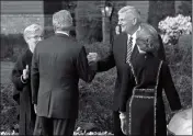  ?? ASSOCIATED PRESS ?? FORMER PRESIDENT GEORGE W. BUSH (second from left) shakes hands with Franklin Graham (second from right) as Jane Graham (left) and Laura Bush (right) look on after the Bushes paid their respects to Billy Graham during a public viewing at the Billy...