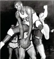  ?? AP FILE PHOTO ?? 1961: Cincinnati ends Ohio State’s 32-game winning streak with a 70-65 win in the NCAA basketball championsh­ip. Pictured is Paul Rogue of the Bearcats pulling down a rebound.