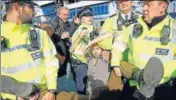  ?? REUTERS ?? ■ Police officers detain a climate protester during a demonstrat­ion at London City Airport on Thursday.