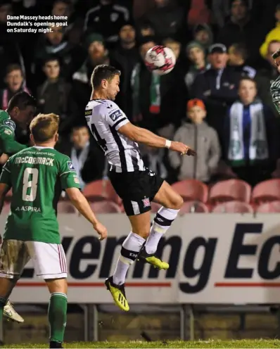  ??  ?? Dane Massey heads home Dundalk’s opening goal on Saturday night.