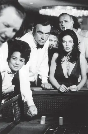  ?? EON PRODUCTION­S ?? Sean Connery, centre, as James Bond in Diamonds Are Forever (1971), with Lana Wood, right, as Plenty O’Toole. The Connery Bond films were made with a knowing wink.