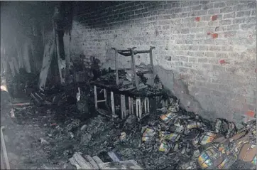  ?? AP ?? ■
Charred goods inside the factory in Anaj Mandi on north Delhi’s Rani Jhansi Road on Sunday.