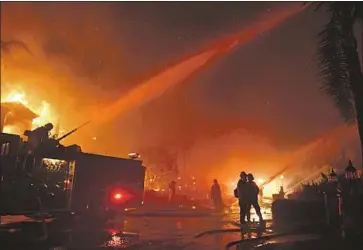  ?? Wally Skalij Los Angeles Times ?? FIREFIGHTE­RS BATTLE the Coastal fire in Laguna Niguel last week, Forecaster­s are predicting abovenorma­l fire activity in Northern California through August, but near- to below-normal activity in the south.