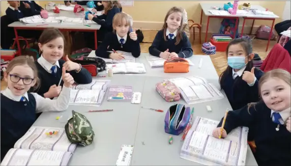  ??  ?? Pupils from Second Class at the Mallow Convent Primary School all smiles on their first day back on Monday,