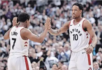  ?? NATHAN DENETTE THE CANADIAN PRESS ?? Raptors’ Kyle Lowry and teammate DeMar DeRozan (10) celebrate a basket against the Washington Wizards in Toronto on Tuesday. Dwane Casey remembers the “powwow” he had with DeRozan and Lowry.