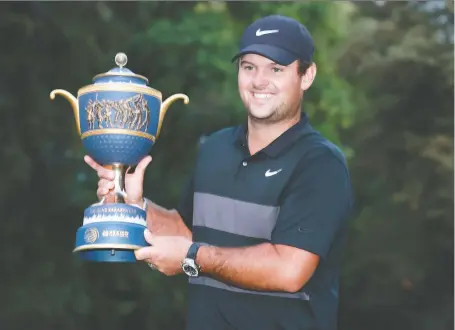  ?? HECTOR VIVAS/GETTY IMAGES ?? Patrick Reed hoists the trophy after having birdied three of the last four holes in the final round to win the WGC Mexico Championsh­ip on Sunday. Reed’s ignoring accusation­s of breaking the rules of golf isn’t working, Jon Mccarthy writes.