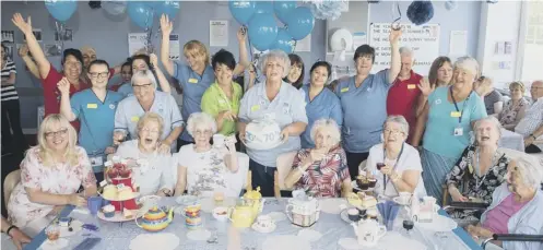  ?? PICTURE: IAN GEORGESON ?? 0 Patients and staff at New Victoria hospital, Glasgow, enjoying a NHS Big7tea party with donations from Asda