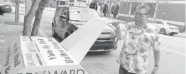  ?? JOE CAVARETTA/SOUTH FLORIDA SUN SENTINEL 2020 ?? A voter drops a ballot into the vote by mail drop box behind the Broward County Government Center in Fort Lauderdale on Nov. 2.