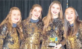  ?? TAMMY EDDERS ?? Lincoln-Way varsity color guard team members, from left, Katherine Keeley, Gabby Vena, Olivia Roberts and Lydia Bednar, after competing at last weekend’s Winter-Guard Internatio­nal Regional Event at Lincoln-Way East High School.