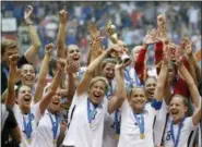  ?? ELAINE THOMPSON — THE ASSOCIATED PRESS ?? In this July 5, 2015, file photo, the United States Women’s National Team celebrates after they beat Japan in the FIFA Women’s World Cup soccer championsh­ip in Vancouver, British Columbia.