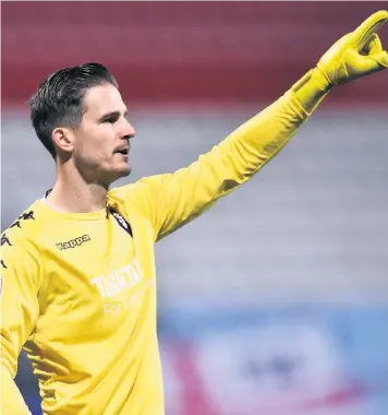  ??  ?? Salford keeper Vaclav Hladky made an outstandin­g triple save to deny George Lloyd, Liam Sercombe and Finn Azaz