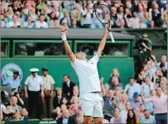 ?? BEN CURTIS/AP PHOTO ?? Switzerlan­d’s Roger Federer celebrates defeating Spain’s Rafael Nadal during a men’s singles semifinal match Friday at Wimbledon. It took Federer five match points before beating Nadal 7-6 (3), 1-6, 6-3, 6-4.