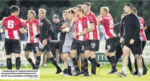  ?? Dave Crawford ?? Celebratio­ns for Saltash United after they knock Plymouth Parkway out of the FA Cup on penalties at Bolitho Park