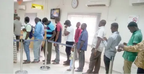  ?? Photo: File photo ?? „ Customers queue up in the bank