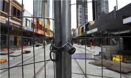  ?? Photograph: Lisa Maree Williams/Getty Images ?? A shut-down tram constructi­on site in Parramatta. Jobs fell 2.6% across Australia in the first three weeks of July, but NSW suffered the most – down nearly 5%.