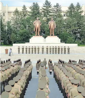  ?? AFP / GETTY IMAGES ?? North Korea military personnel gather Aug. 11 in a rally in support of the regime’s stance against the U.S. in an official Korean Central News Agency photo.
