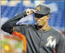  ?? WILFREDO LEE/ THE ASSOCIATED PRESS ?? Marlins second baseman Dee Gordon, shown adjusting his cap while stretching Thursday before Miami’s game against the Cardinals, served an 80-game suspension for a positive drug test.