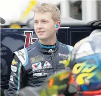  ?? JOHN RAOUX/AP ?? Daytona 500 pole-sitter William Byron takes in the scene from his garage Saturday during practice. Alex Bowman will start on the outside of the front row for today’s race. Defending champion Austin Dillon starts 20th.