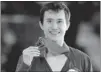  ?? MIKE CASSESE/ REUTERS ?? Patrick Chan holds the gold medal he won Sunday at the Canadian Figure Skating Championsh­ips in Moncton.