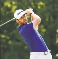  ?? Gregory Shamus / Getty Images ?? Matthew Wolff plays his shot from the 18th tee during the third round of the Rocket Mortgage Classic on Saturday at the Detroit Golf Club.