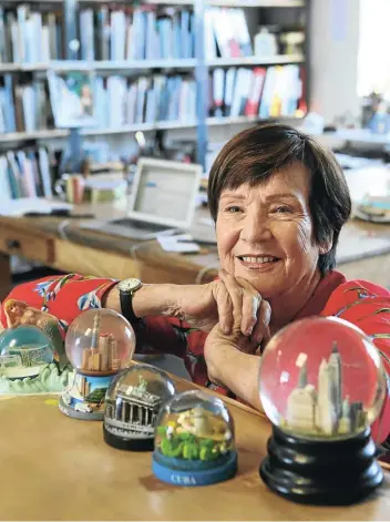  ?? Picture: Ruvan Boshoff ?? Sue Williamson with some of the snow globes in her collection.
