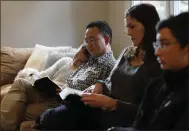  ?? NHAT V. MEYER — STAFF PHOTOGRAPH­ER ?? The Chun family — Lydia, 12, left, David, Leah and Joshua, 13, with their dog, Hobbes — look at their Bibles while watching a live-stream of Calvary Church’s service on Sunday.