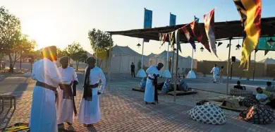 ?? — AP ?? Lively: omani performers preparing for a show for guests at a tent camp site in al Khor.