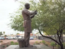  ??  ?? A statue of George Washington Carver stands in front of the George Washington Carver Museum and Cultural Center in Phoenix.