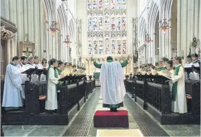  ??  ?? Bath Abbey’s Choir conducted by director of music Huw Williams